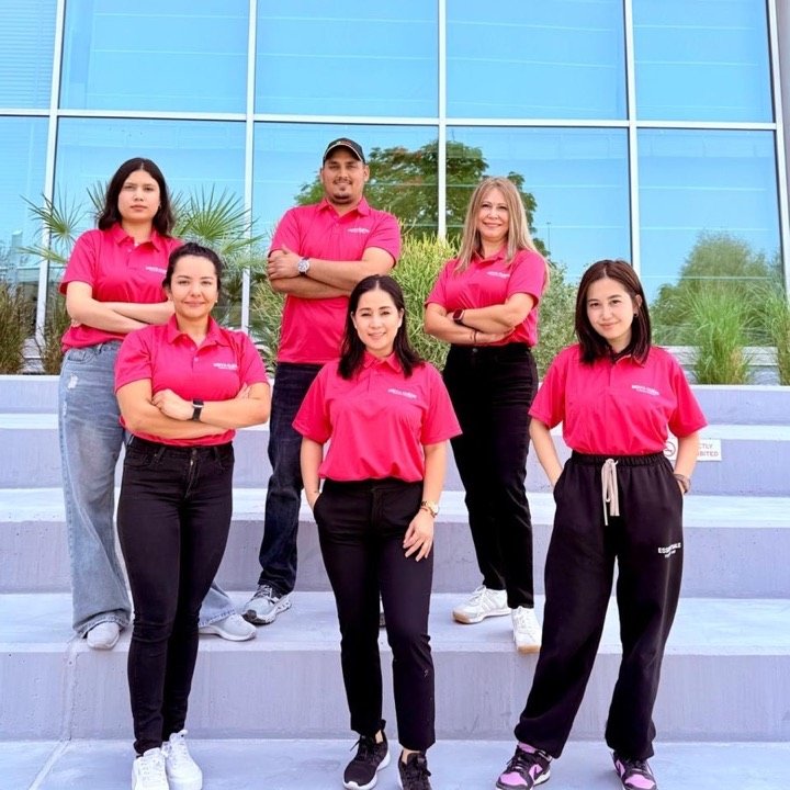 The Nova Clean Services team in their pink uniforms